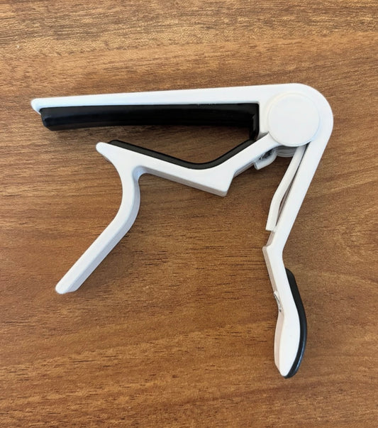 White metallic capo